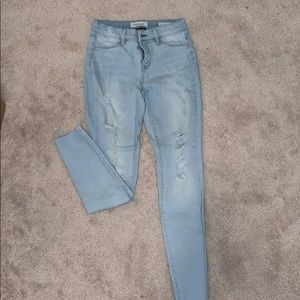 Light colored ripped jeans